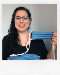 Nurse holding face masks.